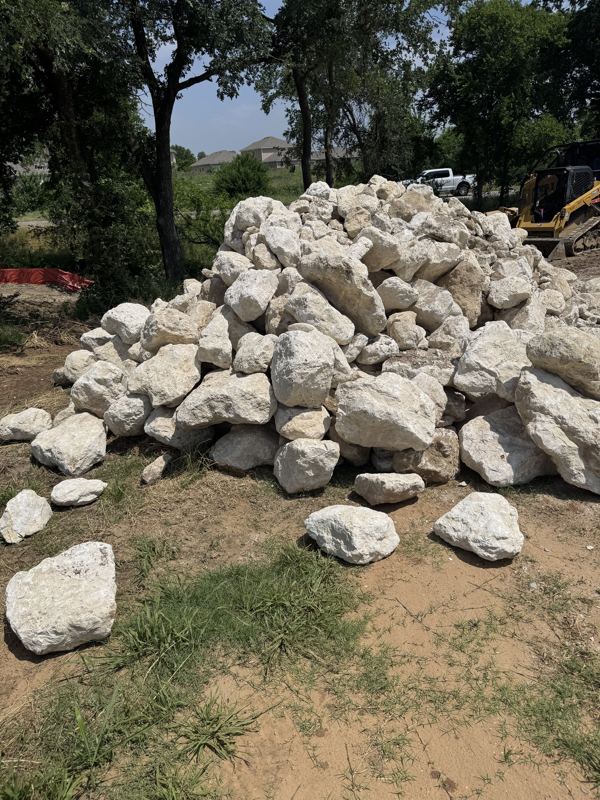 White limestone boulders on a job site