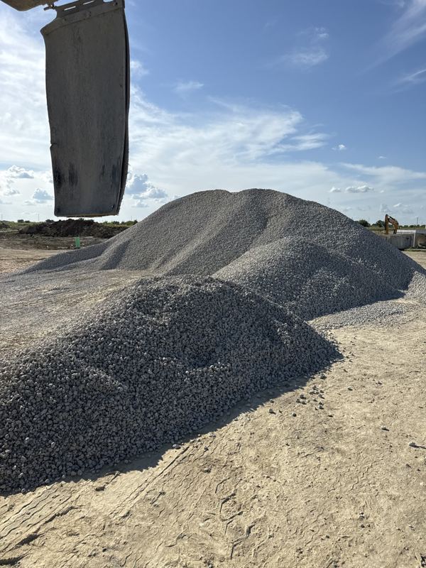 Gray crushed rock dumped on a job site