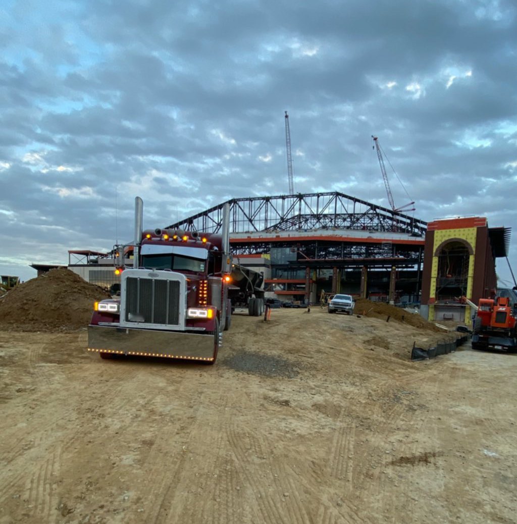 Cobra Haulers Peterbilt end dump on the Globe Life stadium construction site in Arlington
