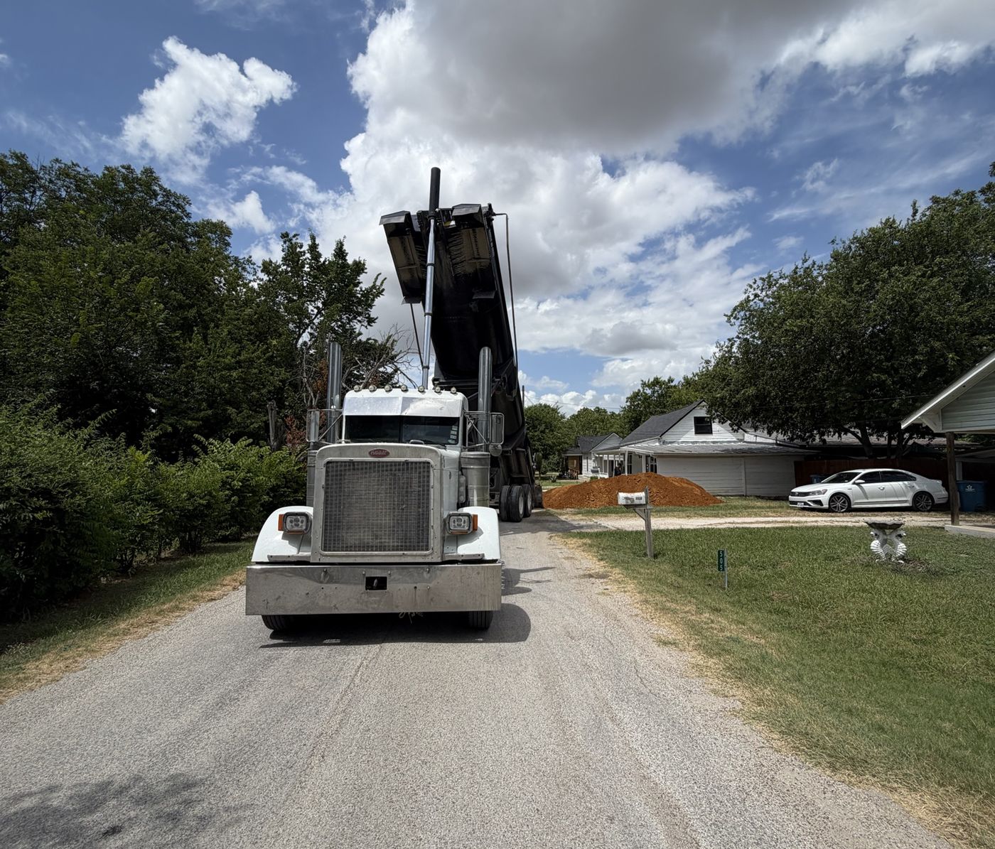 End dump unloading on a residential street