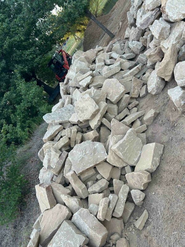Sandstone stacked into a wall on a slope